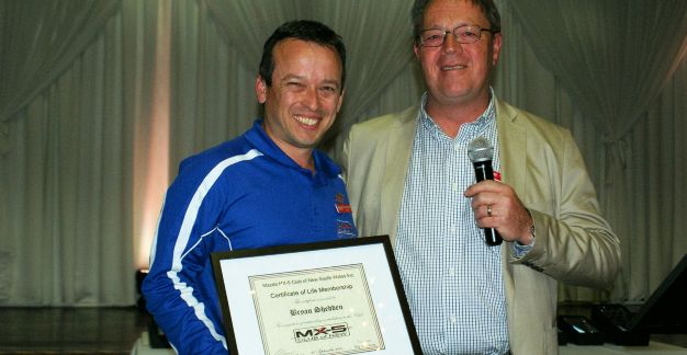 Bryan Shedden being presented with Honorary Life Membership by Vice President Glenn Thomas on 27 September 2015 at the Club 25th Anniversary celebration